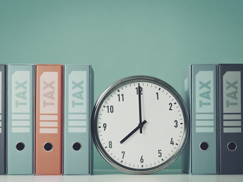 Ring binders containing tax documents and clock Ring binders containing tax documents and clock