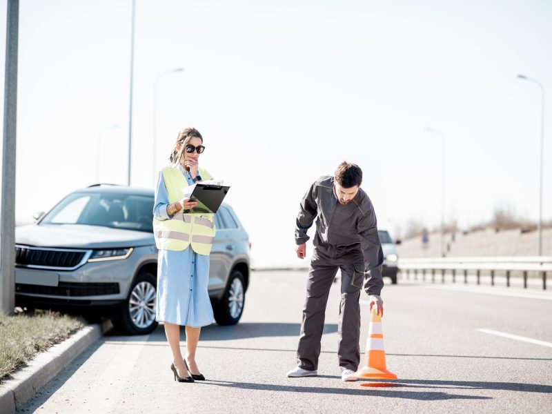 Woman and road worker during the car accident Woman and road worker during the car accident